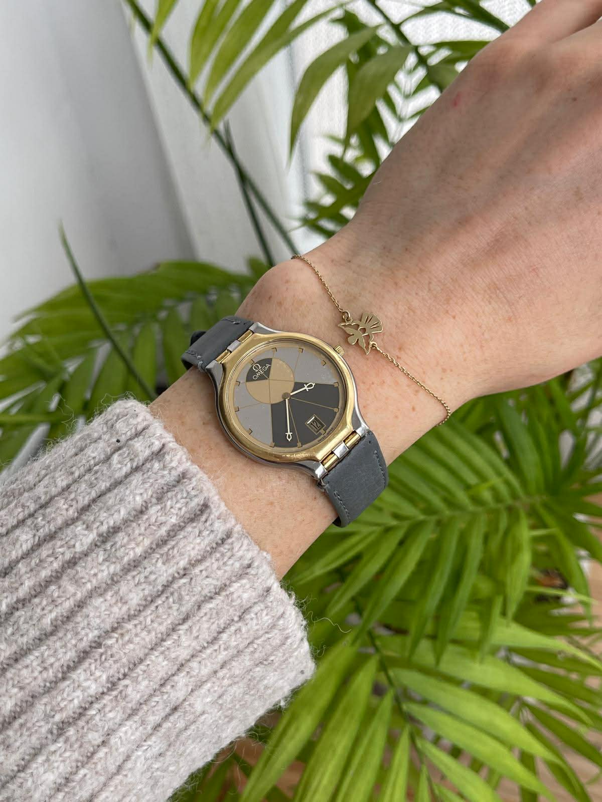 Omega De Ville Symbol - bezel aur 18K